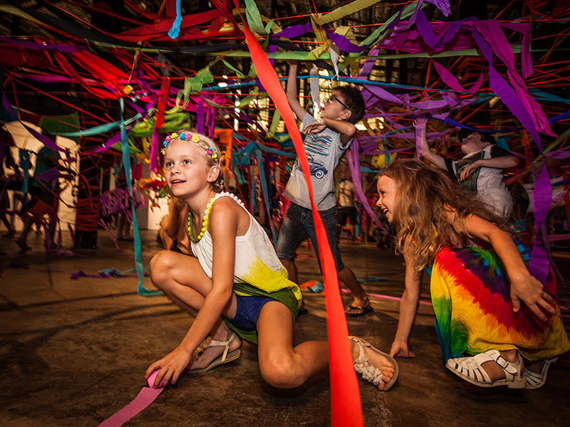 Children playing with colourful ribbons in the tinkering tank