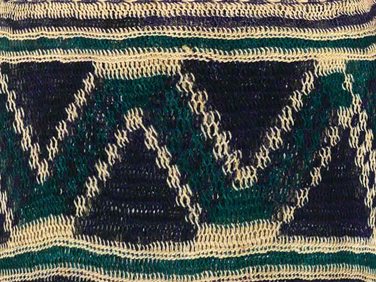 Close up image of a bilum (bag) with a zig zag pattern