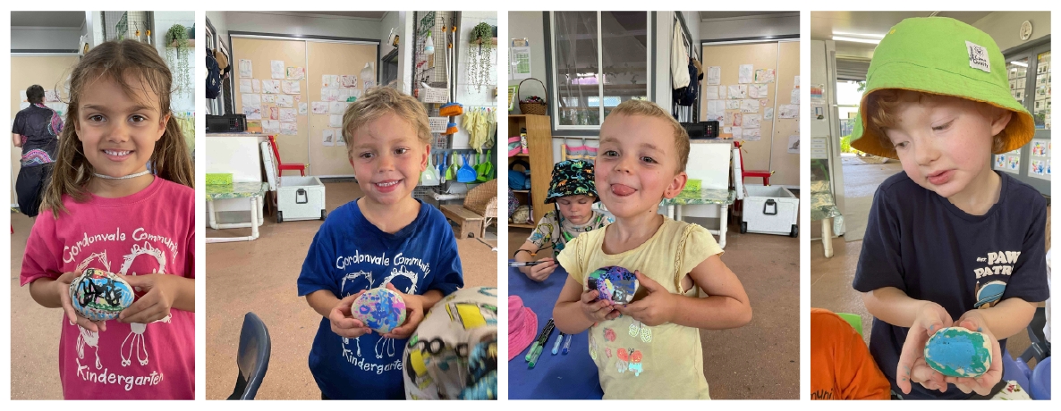 Kindergarten children showing off their painted rocks