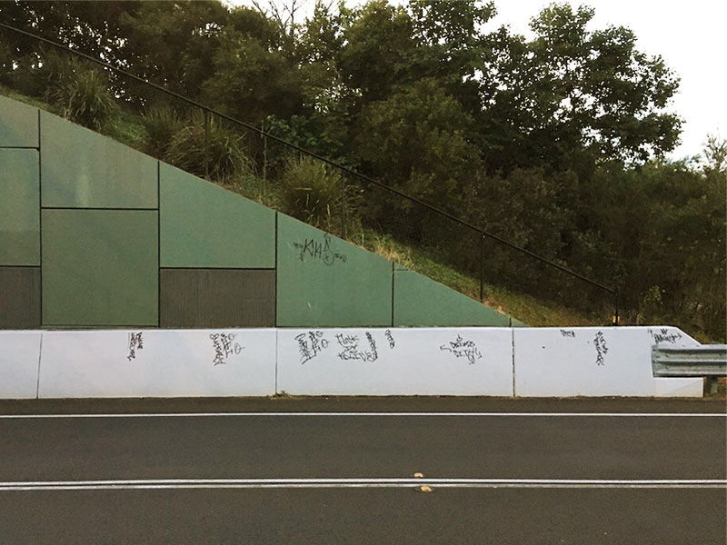 Graffiti tagging on roadway