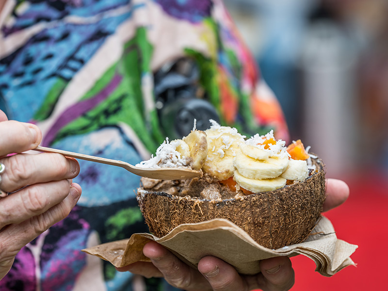 Fruit salad and coconut served in coconut shell at Ecofiesta
