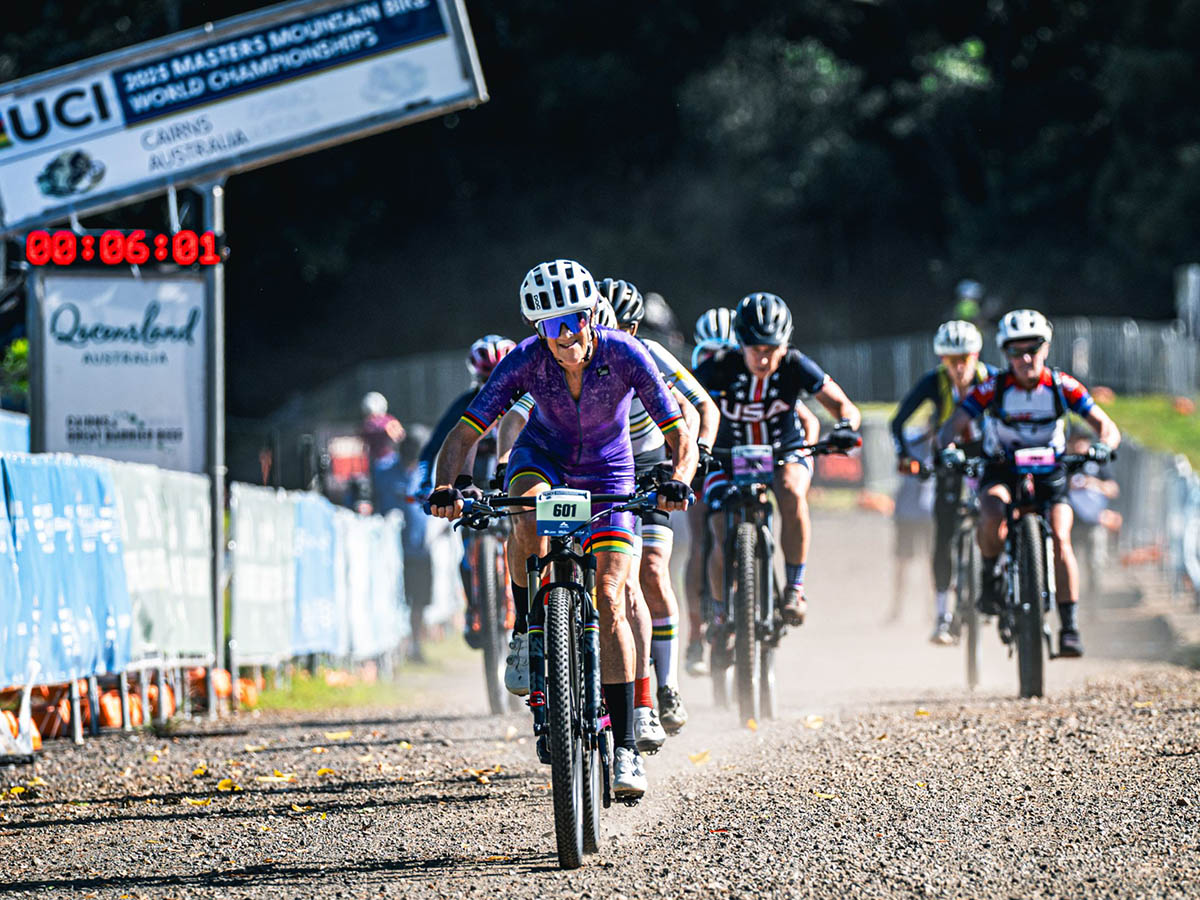 Group of mountain bike racers crossing the finish line at Smithfield Mountain Bike Park in Cairns