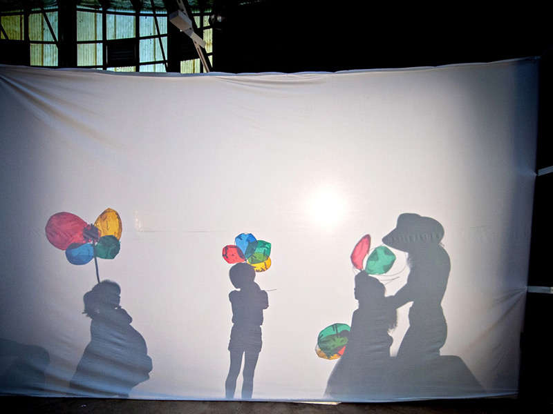 Balloons and children shadow play