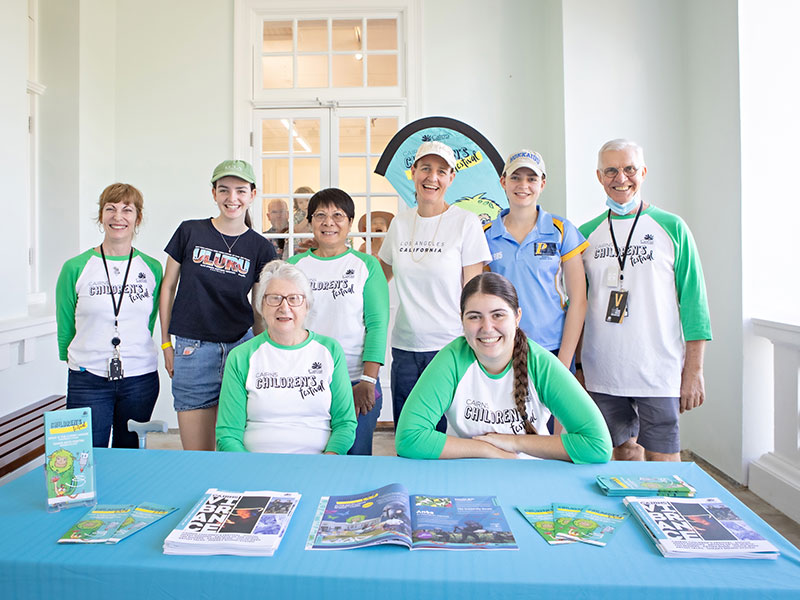 Volunteers in funky uniforms ready to work at Cairns Children's Festival