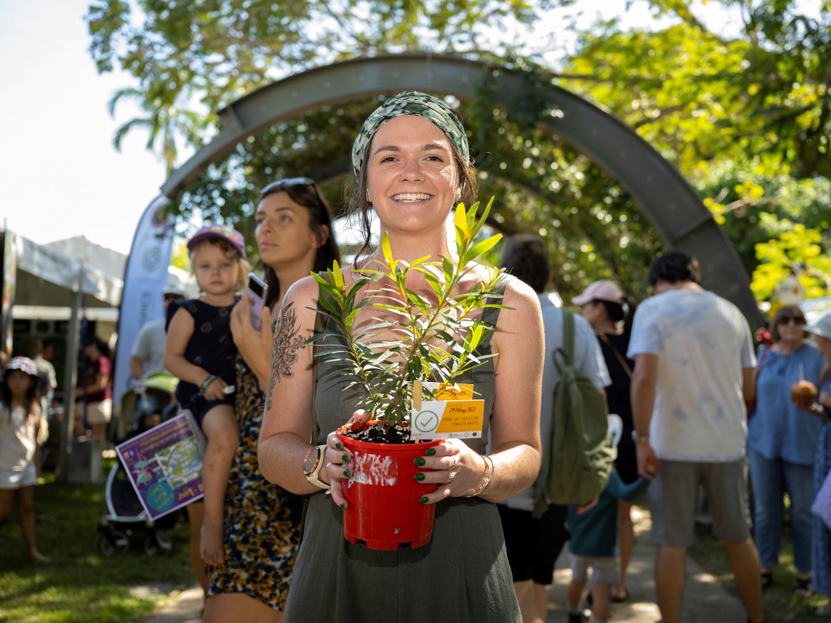 Photo of a woman holding a pot plant