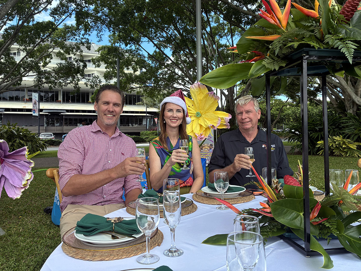Alex Loughton from Kenfrost Homes, Cairns Mayor Amy Eden and Louis Underwood from Underwood Party Hire toast at the launch of the 2026 Mayor's Christmas Charity.