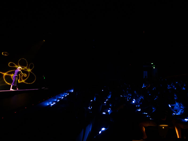 Light show performance on a darkened stage