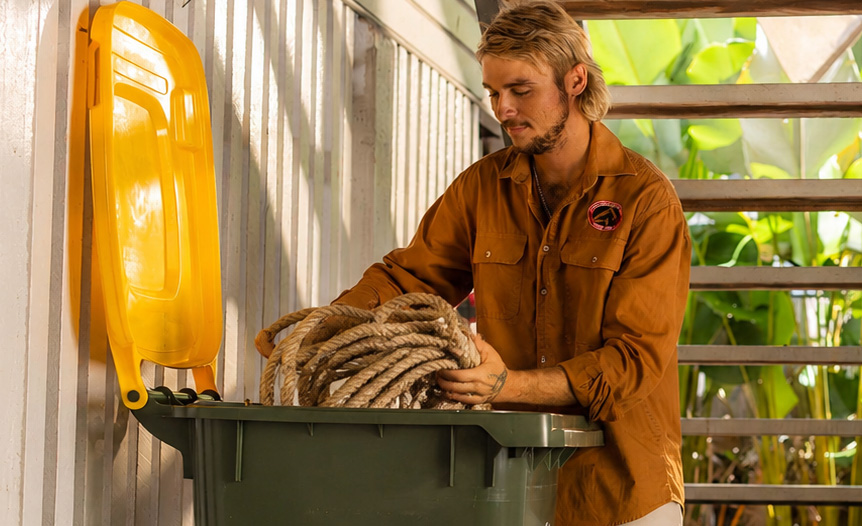 Resident checking hazardous household items before disposal